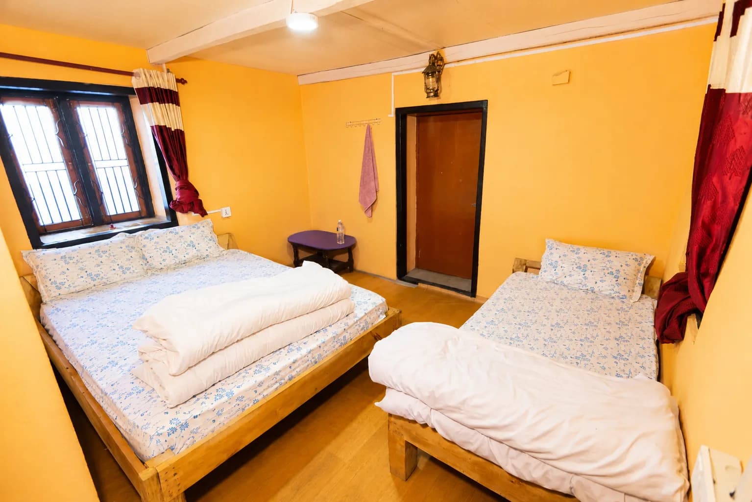 Spacious and peaceful room with traditional wooden charm.